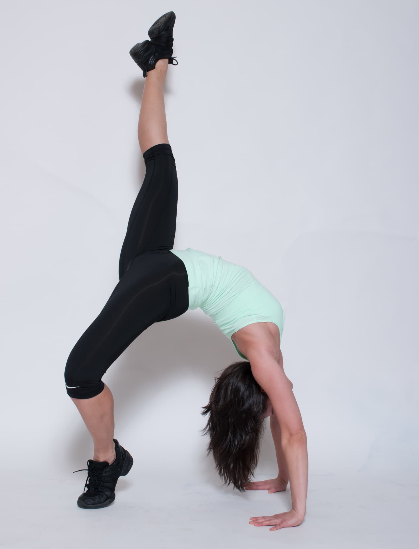 Nadya in a one-legged bridge stretch