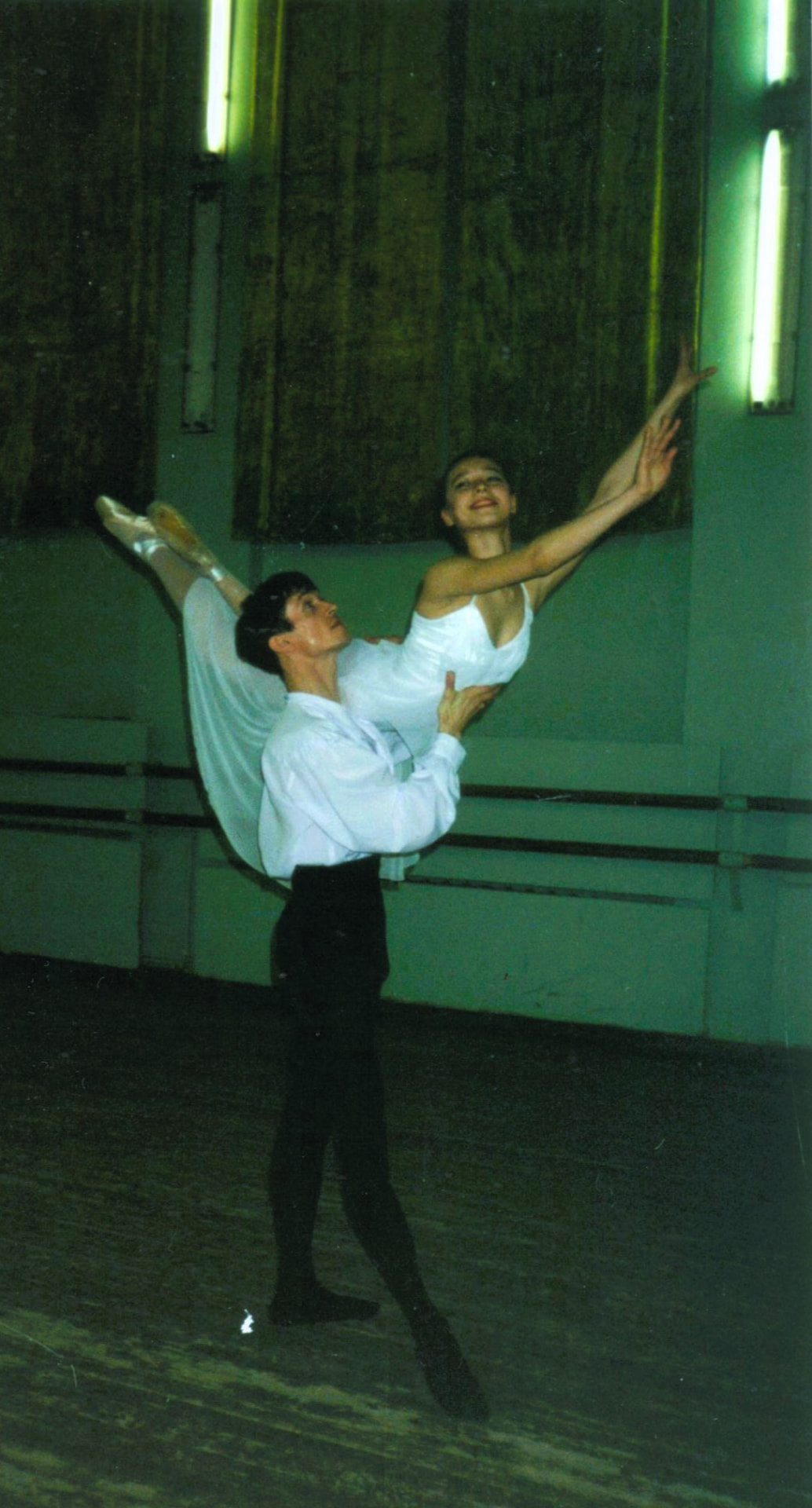 Nadya performing a partnered lift during her professional dance career